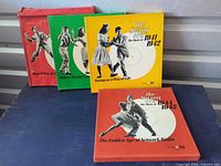 Front view of four Time-Life Swing Era box sets showing cover art and color variations