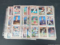 Multiple nine-pocket pages filled with Topps 40th Anniversary baseball cards