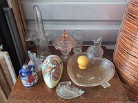 Group shot showing all glass and ceramic items on wooden surface