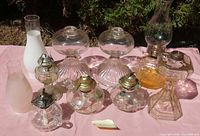Group shot showing all oil lamps and chimneys