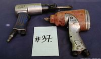 Top view of both pneumatic tools with lot number card