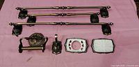 Full set laid out: three towel bars, toilet paper holder, hook, toothbrush holder, soap dish