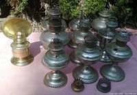 Group shot of all lamp bodies and parts on cloth backdrop