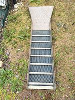 Top view of full sluice box showing flared intake, riffles and matting
