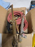 Brass torch handle with hose and regulator in box