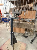 Full view of bench vise mounted on pedestal stand