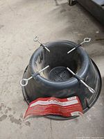 Plastic tree stand with label and eye-bolt clamps