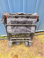 Wagon folded, showing mesh pocket and wheels