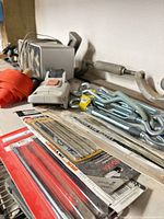 overview of drill bits, hooks, strap, handheld module
