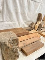 Stacked hardwood beams and blocks on tabletop