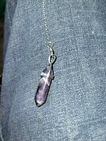 Close view of amethyst crystal pendulum