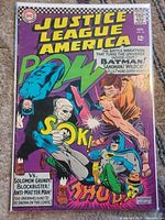 Front cover of bagged Justice League of America #46 comic
