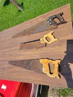 All three saws laid on table showing full view
