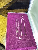 Necklace chain and bracelet chain on magenta box insert
