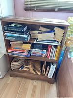 Front view of wood bookshelf with contents (books not included)