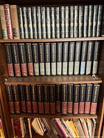 Bookcase with Encyclopaedia Britannica set, Harvard Classics volumes and assorted books