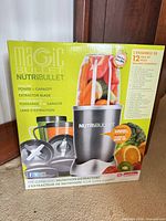 Front of boxed NutriBullet 12-piece blender set showing contents and 600 W power
