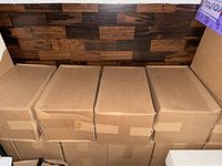 Four taped cardboard boxes side-by-side