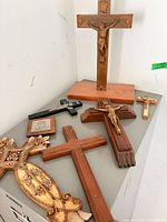 Group of crosses and plaque on cabinet