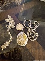 Group showing both pendants, both chains