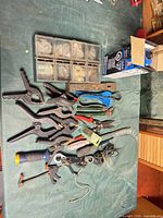 Group shot of all hand tools, clamps, torch box, organizer case on table