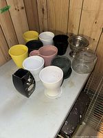 Group shot of all vases and planters on table