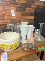 Group shot of all vases, floral bowl, and tray of stones