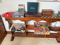 Shelf with multiple vintage games visible