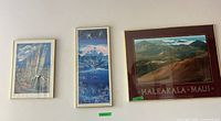 All three framed prints on wall