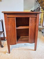 Front view showing paneled doors and shelf layout