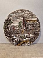 Front view of entire scenic village transferware plate