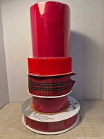 Stack of six ribbon rolls showing colors and varying widths