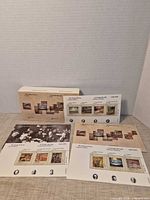 All four souvenir stamp sheets with folders arranged for overview