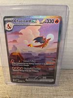 Front view of Charizard GX card in top loader