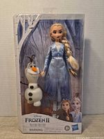 Front view of boxed Elsa doll and Olaf figure