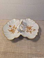 Top view showing two compartments, floral pattern, gold rim
