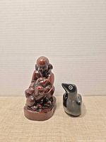 Front view of both figurines