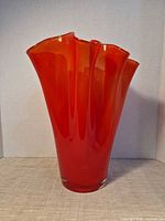 Full front view of red art glass vase