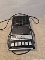 Top view of Sears cassette recorder showing speaker grille, tape compartment, power cord