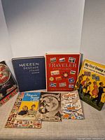Front view of all seven albums upright and flat