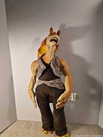 Full frontal view of Jar Jar Binks plush showing overall condition and clothing