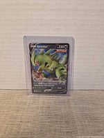 Card in top loader front view