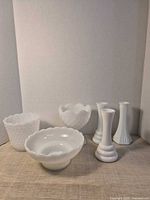 All six milk glass items arranged together