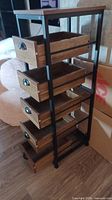 Front angled view of organizer showing five drawers in various open positions