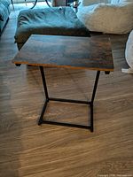 Full view of wood top and metal base side table