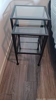 Pair of nesting tables side by side showing relative sizes