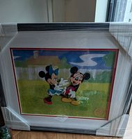 Framed serigraph with protective wrapping