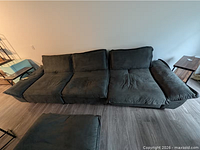 Front view of full four-seat sectional reclining sofa