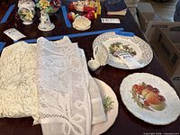 Lot overview showing both decorative plates on table