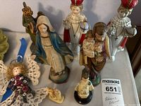 Group of various religious figurines displayed together